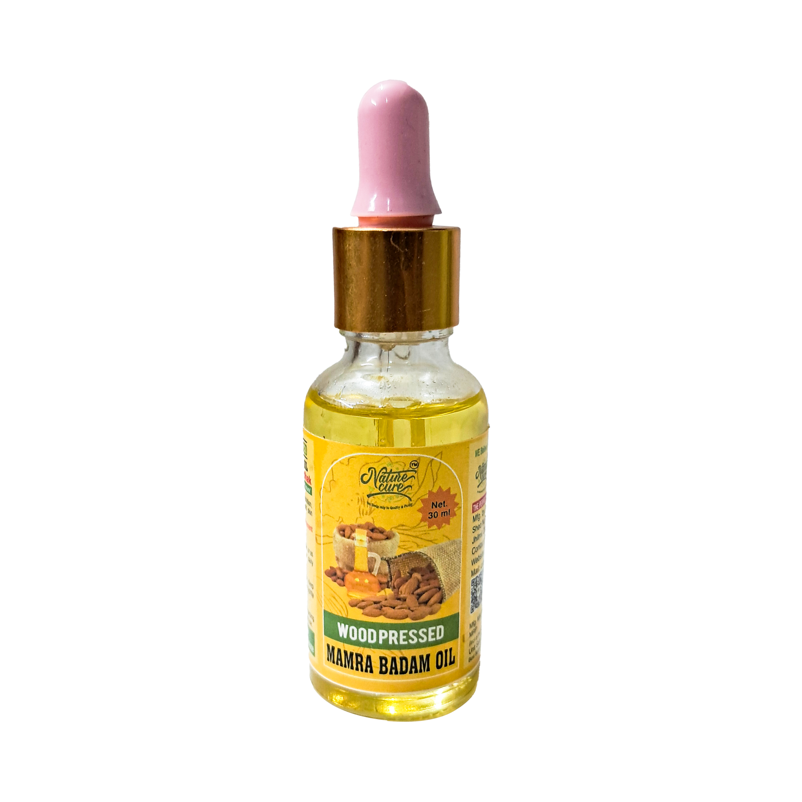 Naturecure wood pressed mamra badam oil 30ml glass dropper bottle with almonds on wooden background